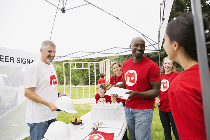 nonprofit organization with volunteers group of nonprofit volunteers at outside event