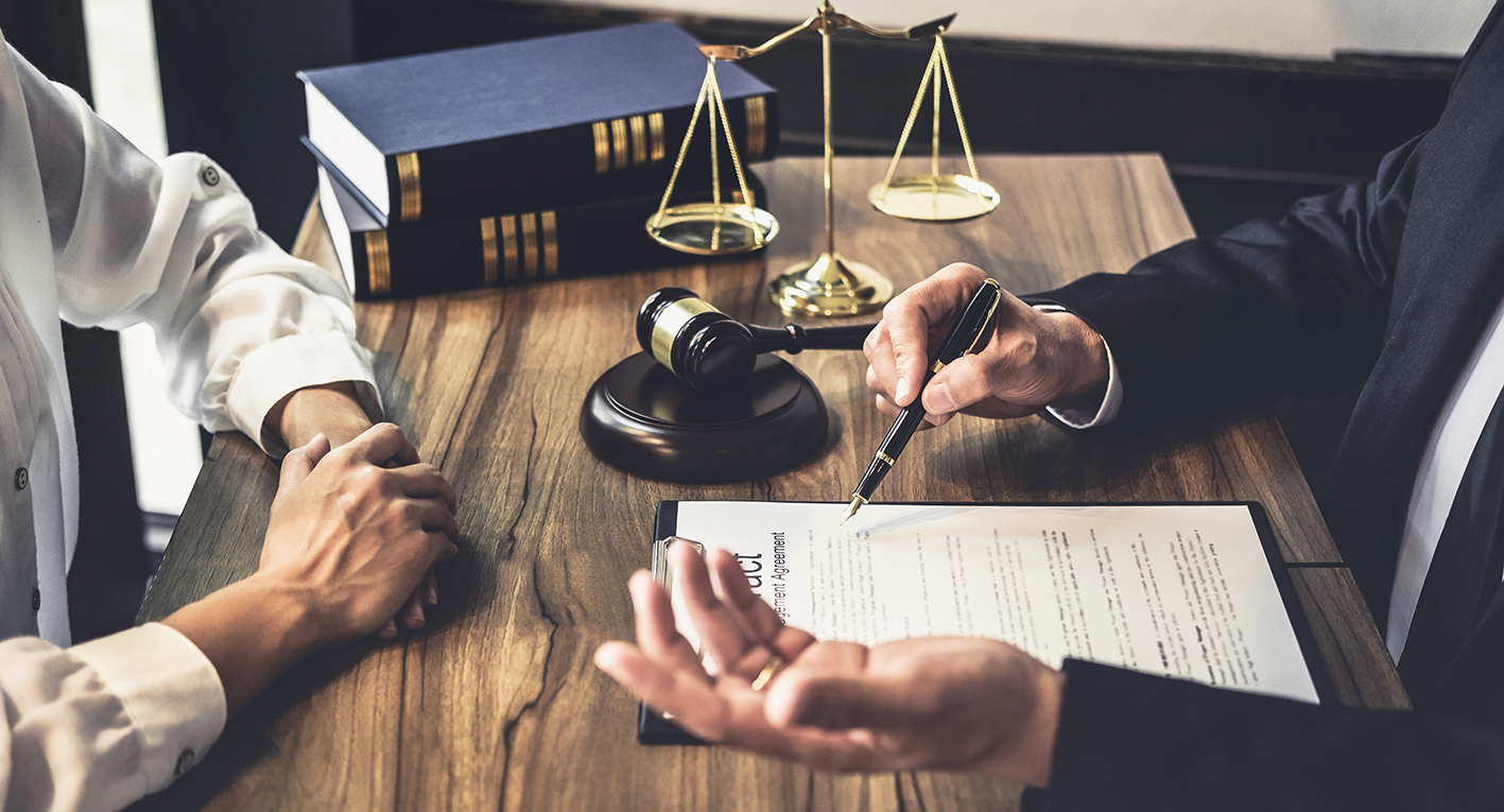 Lawyer's office with contract on table with gavel