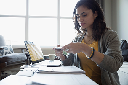 Business woman making mobile check deposit