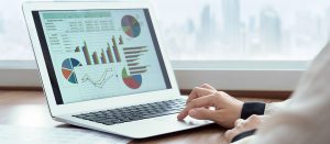 accounting software displaying graphs on laptop