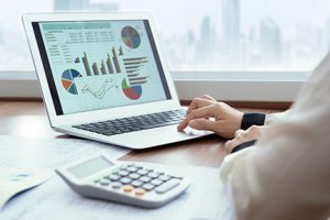 accounting software displaying graphs on laptop