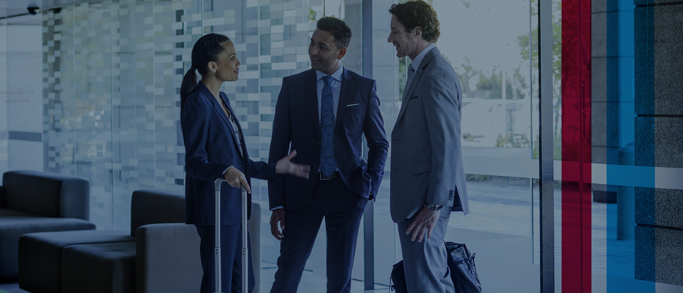 Three business people in discussion