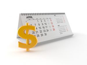 3D dollar sign next to desktop calendar