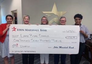 JMB Woodbridge Team Giving Lake Ridge Chorale Oversized Donation Check