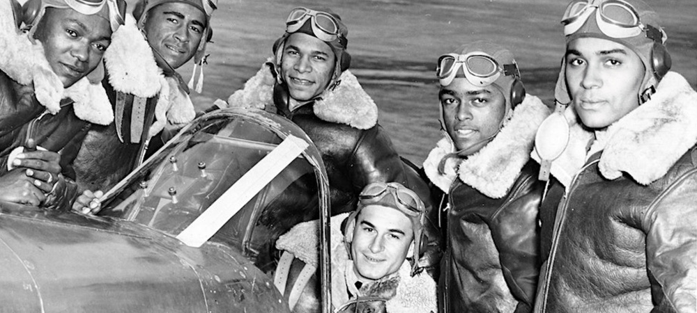 The traveling RISE ABOVE exhibit. which tells the story of the Tuskegee Airmen (pictured) and the Women Airforce Service Pilots (WASP), is coming to the Manassas Airport from August 21-27 thanks, in part, to John Marshall Bank.