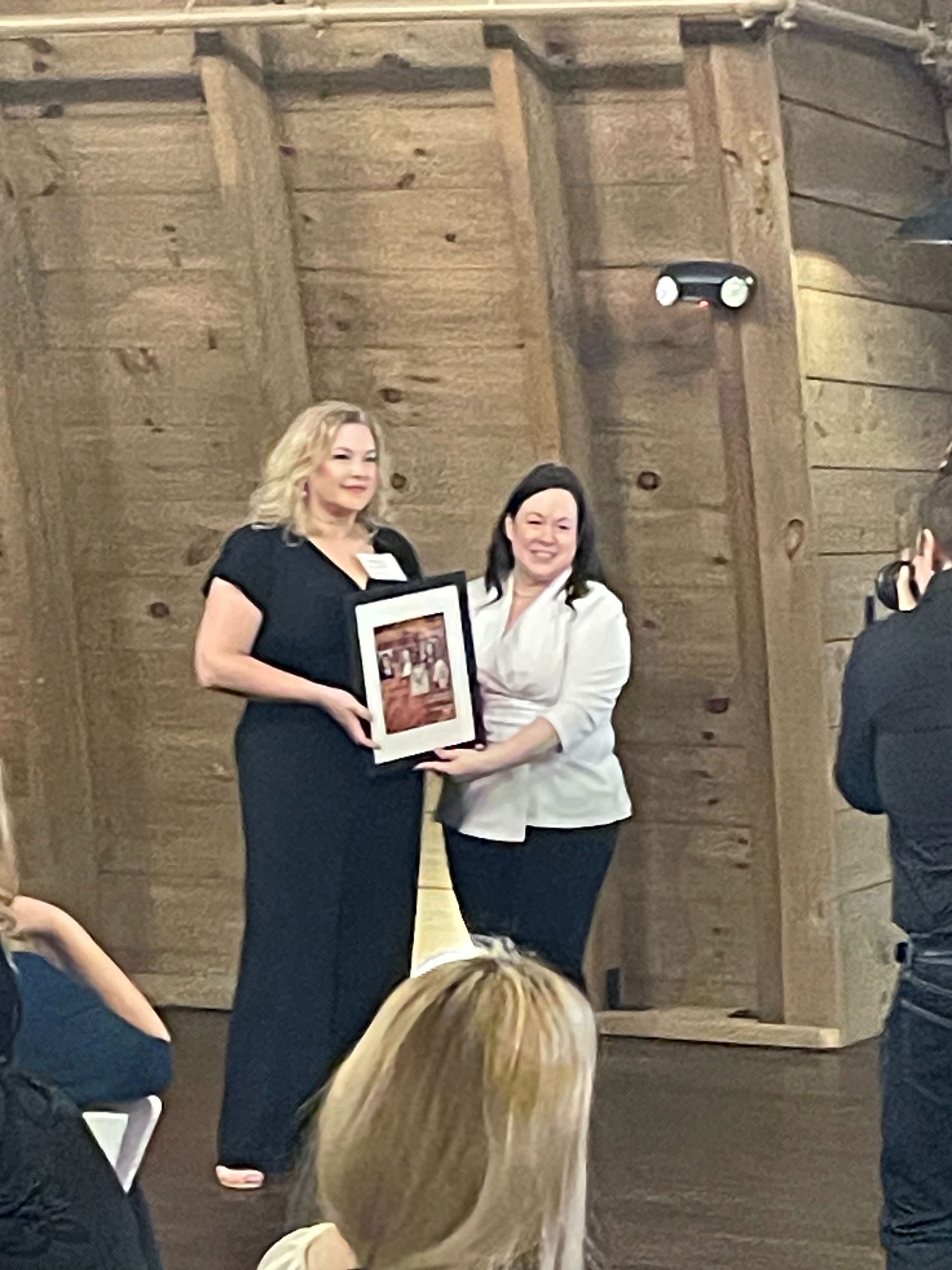 JMB's Kimberly Bradford receiving the 2024 Influential Women Award from Prince William Living Magazine