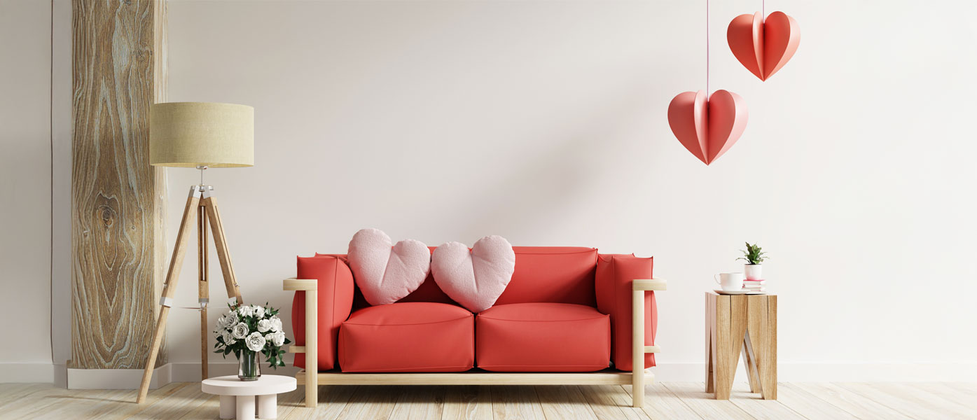 heart pillows on sofa in cozy living room