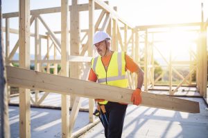 Trade contractor in hard hat working on construction