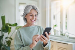 Mature Woman Using Mobile Banking