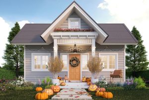 Small Cap Cod style single family home adorned with pumpkins in the fall