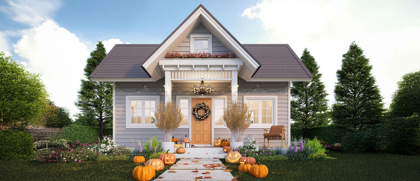 Small cape cod style single family home adorned with pumpkins in the fall