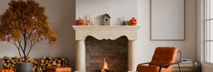 mantel with birdhouse and pumpkins in living rooom scene